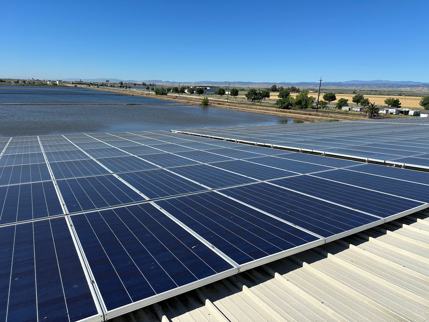 440 solar panels on the Superior Products warehouse roof above the rice fields